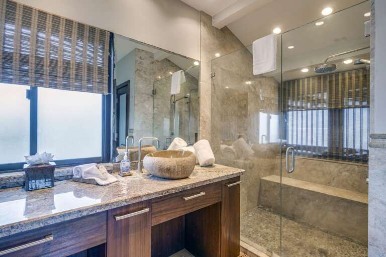 Nice walk-in shower with a bench and natural light. Nice walk-in shower with a bench and natural light.