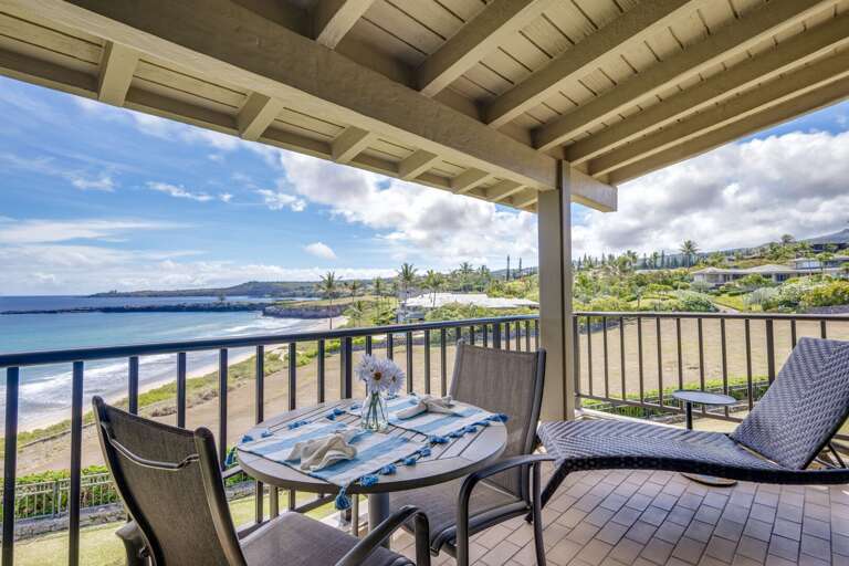 Oceanfront lanai with dining for 2 and a lounge chair. Oceanfront lanai with dining for 2 and a lounge chair.