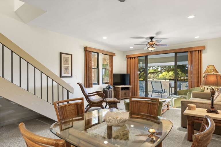 Dining and family living room area with stairs leading up to second floor