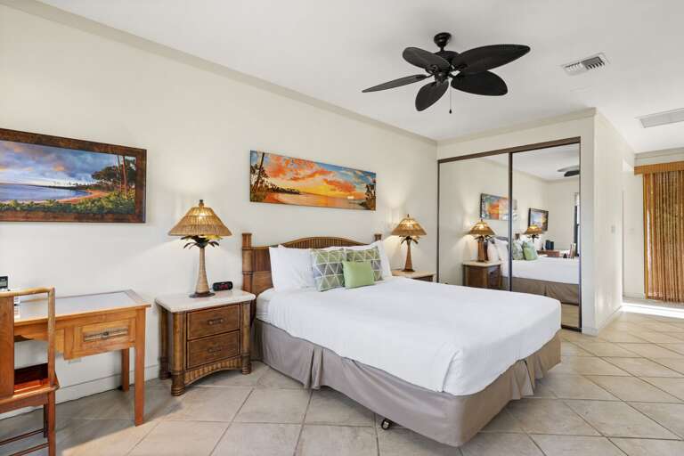 Sunset photo above plush king bed to set the mood