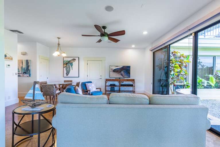 Bright open living room with large sliding doors and abundant natural light.