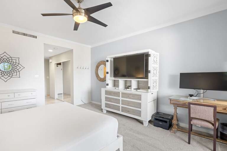 Bedroom includes a desk and computer screen