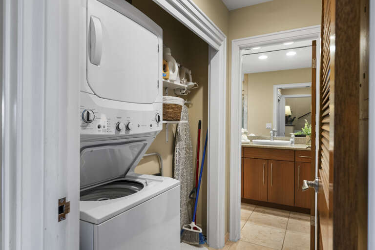 washer and dryer on the first floor with a full guest bathroom
