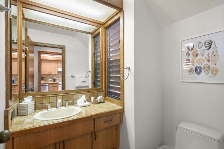 1st-floor guest bathroom with a shower stall