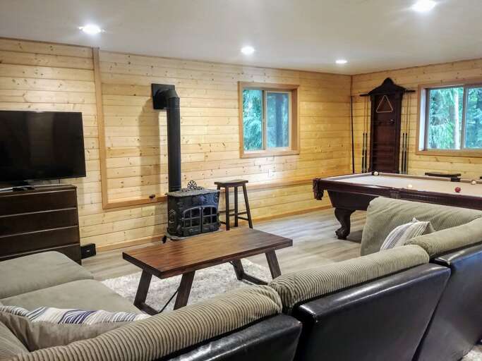 Entertainment room with a free standing gas fireplace