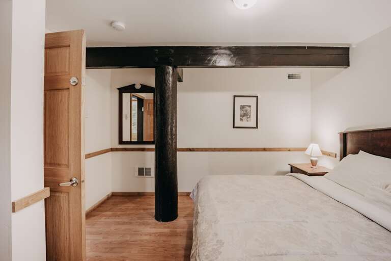 3rd downstairs bedroom with king bed