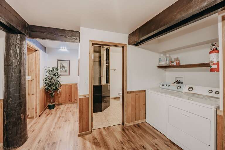 Downstairs laundry area, bathroom and hall