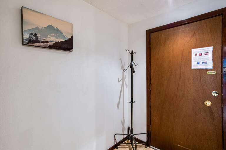 Inside entry with coat rack Inside entry with coat rack