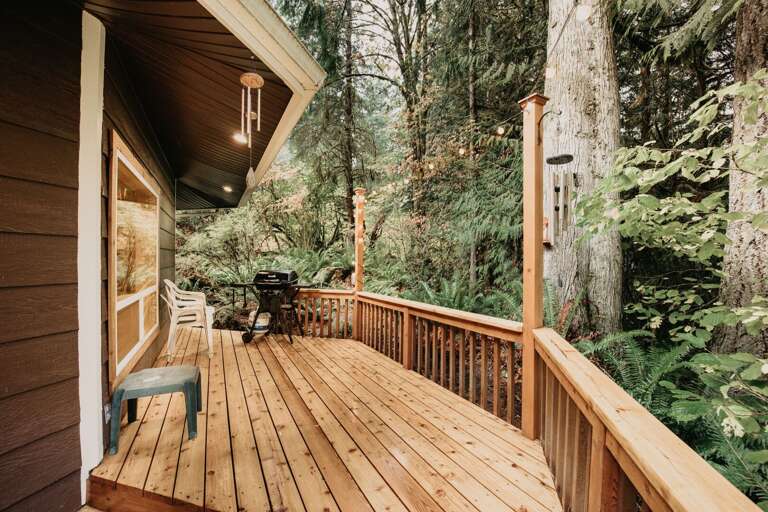 Another view of the outside balcony and deck with BBQ Another view of the outside balcony and deck with BBQ