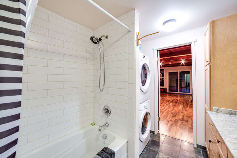 Second bathroom with laundry area