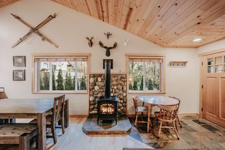 Another view of the dining table, propane fireplace, sitting area