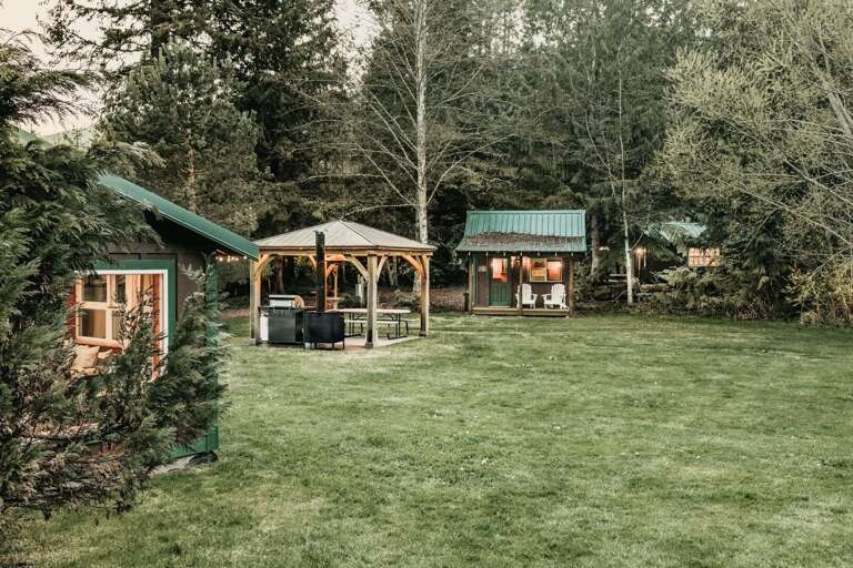Outside the cabin theres a gazebo and game room.