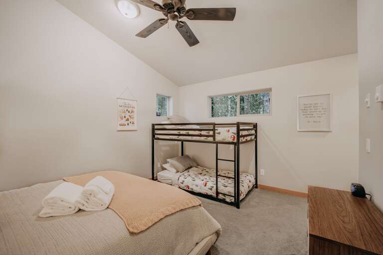 2nd floor bedroom with a queen bed and a set of bunk beds