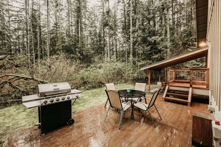 Outside deck with table and bbq