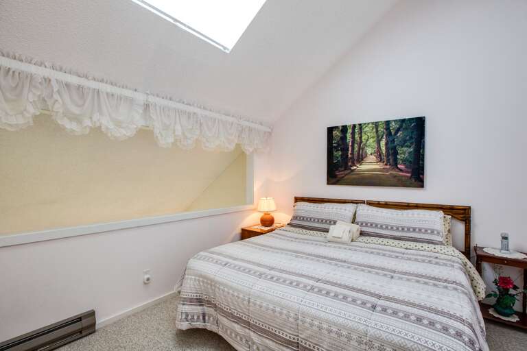 Upstairs bedroom with king bed Upstairs bedroom with king bed