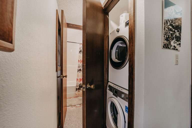 Laundry area looking into upstairs bathroom