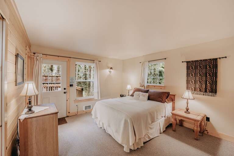 Master Bedroom with door to hot tub and back deck