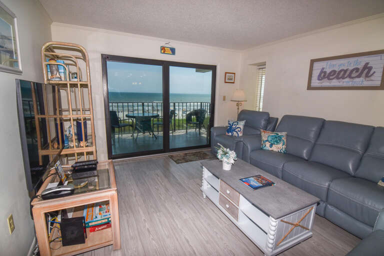 Beachfront Living Room Leading To Balcony With Breathtaking Sea View
