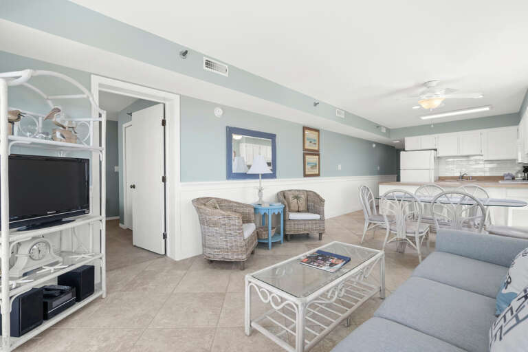 Vacation Rental Interior, Pale Blues And Crisp Whites, Open Living Space With Kitchen And Dining Areas
