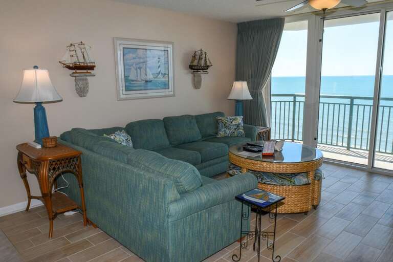 Seaside Suite Showing Spacious Seating, Serene Sea View Through Sliding Glass Door