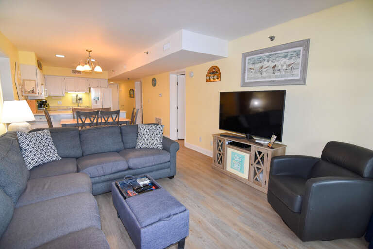 Light, Large Living Room In Vacation Rental With Sofas And Television