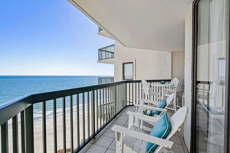 Balcony View Of Blue Beach And Bright Sky
