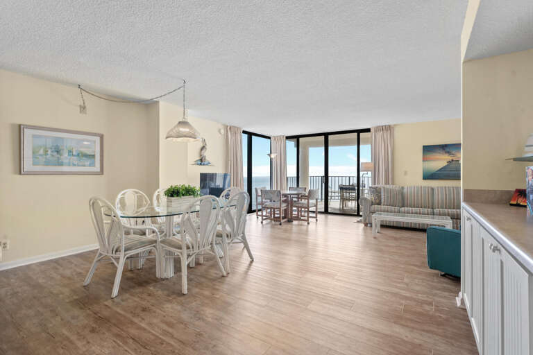 Bright Beachside Room Boasting Balcony View, Breezy Blues Visible