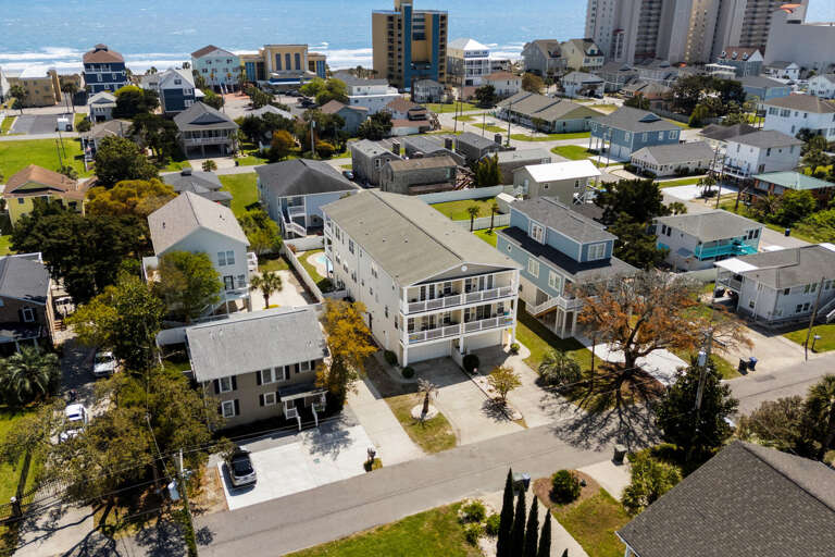 Aerial View Of White Buildings Beside Beach