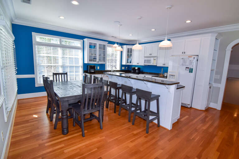 Blue-bordered Bright Breakfast Bar In Vacation Rental With Shiny Wooden Floors
