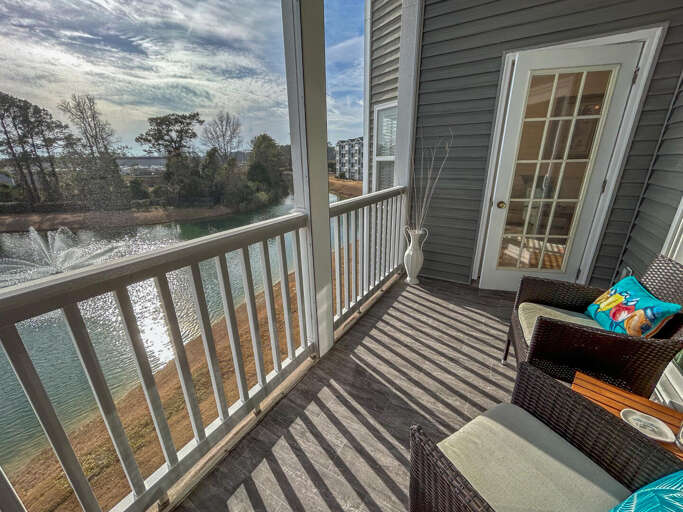 Balcony View Over Serene Waters At A Vacation Rental