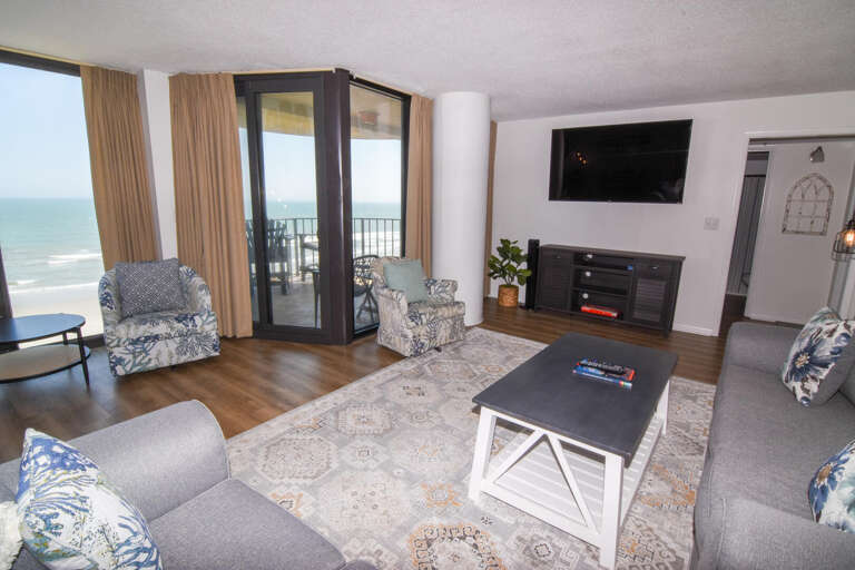 Living Space With Sea View Sliding Doors And Sleek Sofas