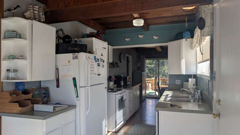 galley kitchen connects the dining room to family room