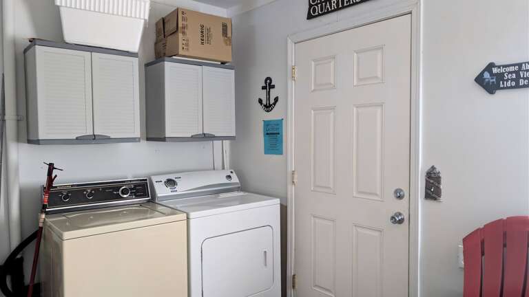Laundry in Garage - door to back yard/deck