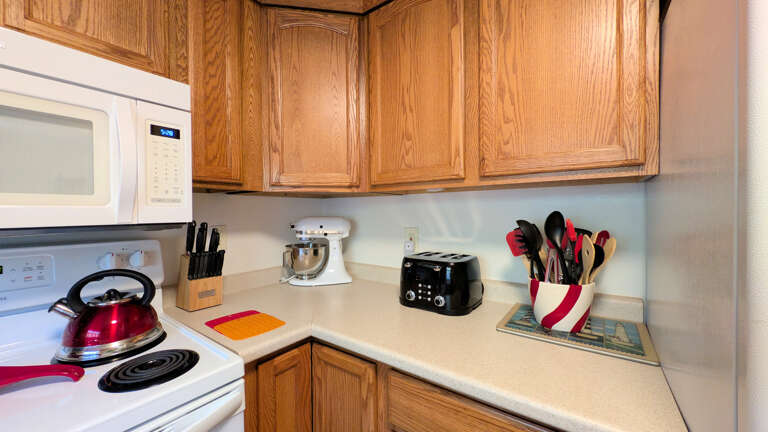 kitchen with electric range &amp; stand mixer