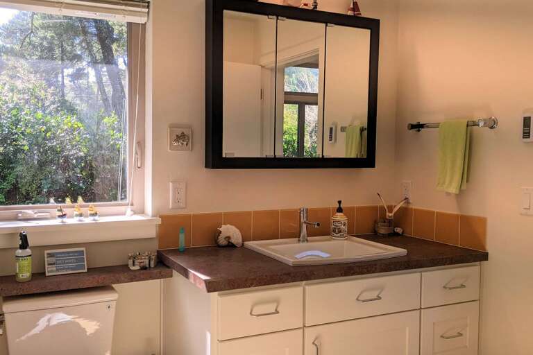 main bath with door to hallway and bedroom