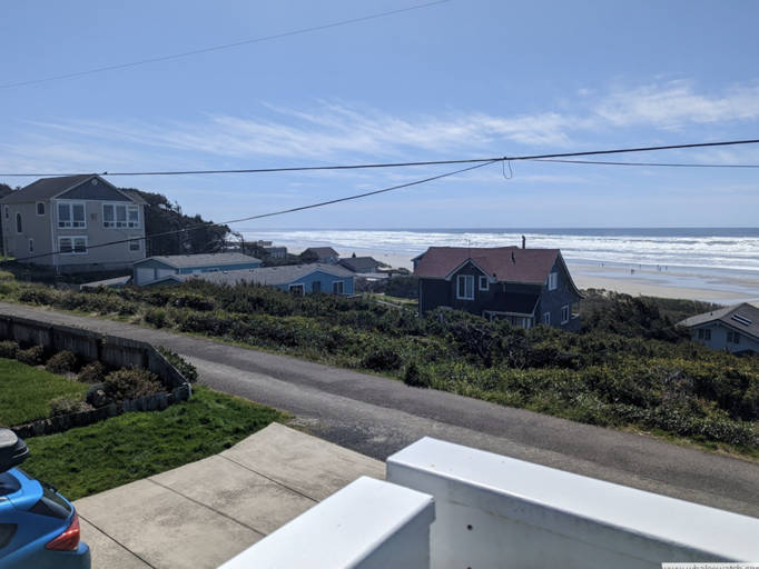 Seaside Vacation Rental View With Beach And Houses