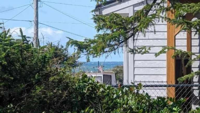 a distant peek of the ocean from the deck