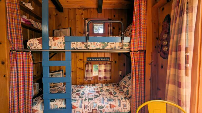 twin bunks each with curtains to close them off