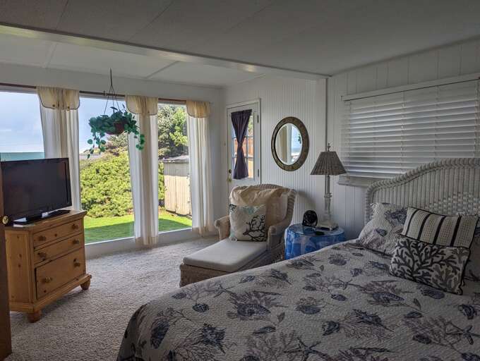 queen bedroom with TV