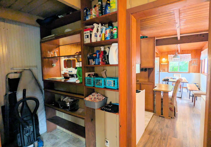 utility/laundry room between kitchen and living room