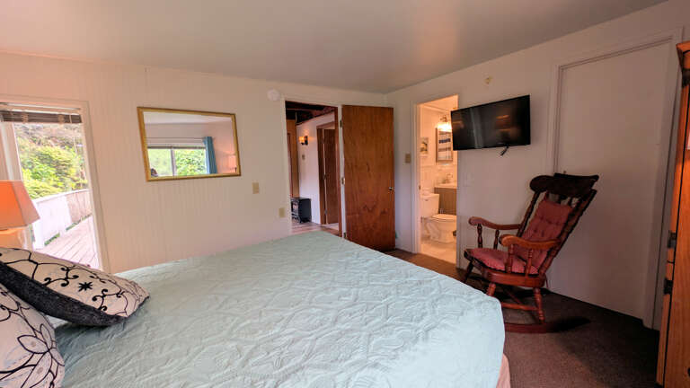 queen bedroom has its own tv and rocking chair