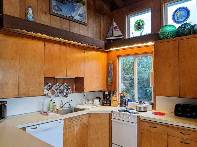 kitchen with small range full size dishwasher