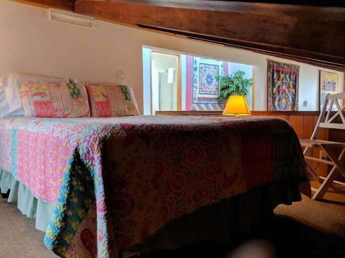 queen bed in open loft - low ceiling