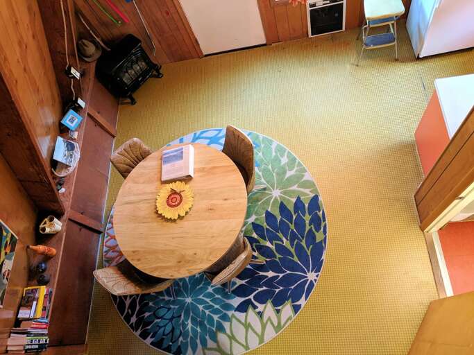 looking down on dining area from loft