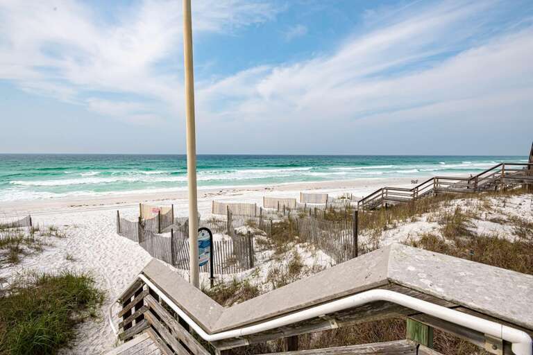 Beach Boardwalk Beside Bright Blue Sea