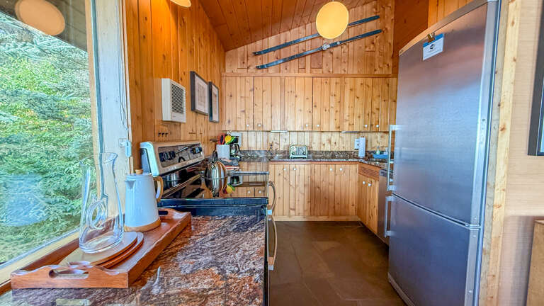 The fully renovated, well-appointed kitchen features granite countertops and stainless steel appliances so you can prepare meals during your stay. The fully renovated, well-appointed kitchen features granite countertops and stainless steel appliances so you can prepare meals during your stay.