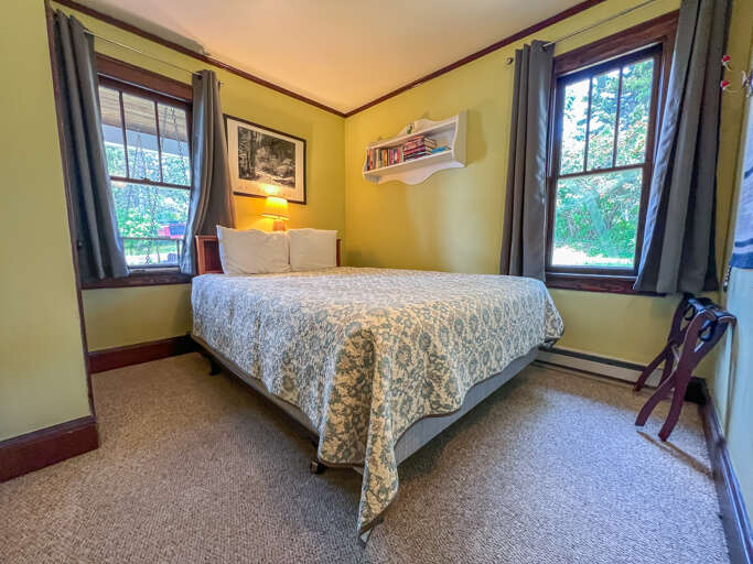 The master bedroom features a queen bed.