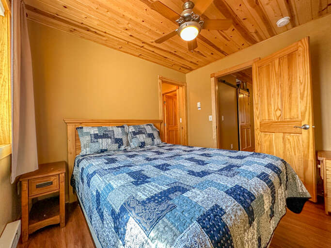 This room features a queen bed.