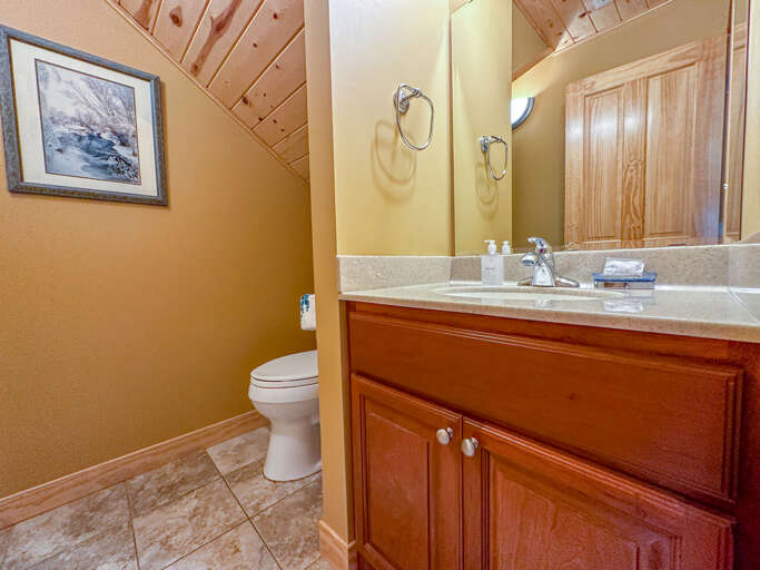 Main level half bathroom.