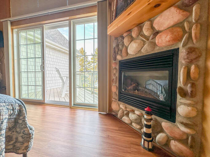 Stone surround gas fireplace.